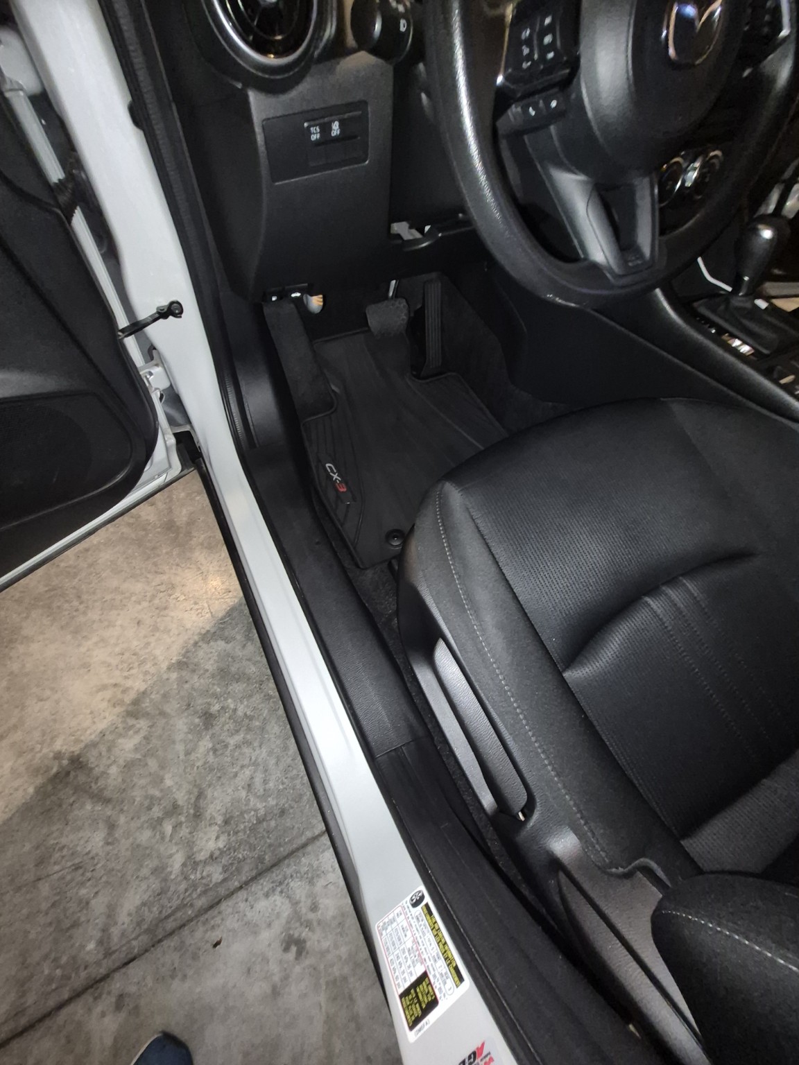 Clean car driver-side floor after interior detailing