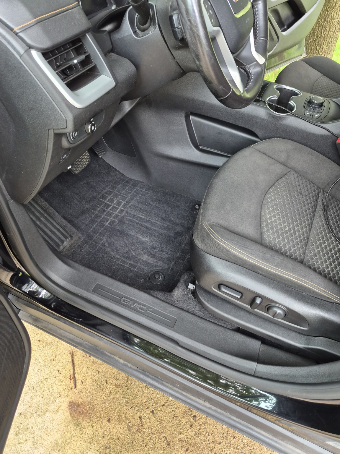 Clean GMC driver-side floor after interior detailing
