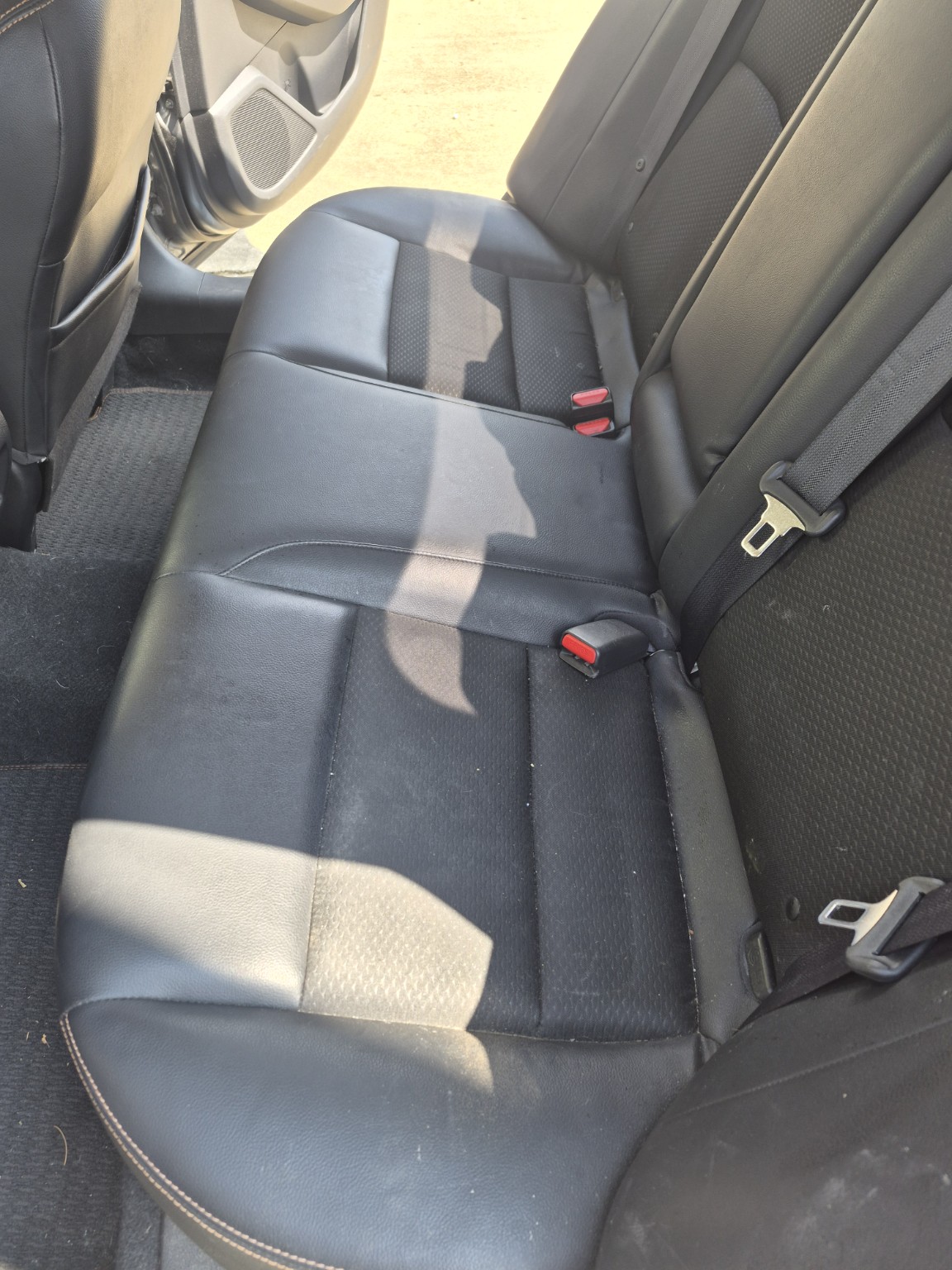 Car rear seat before interior detailing