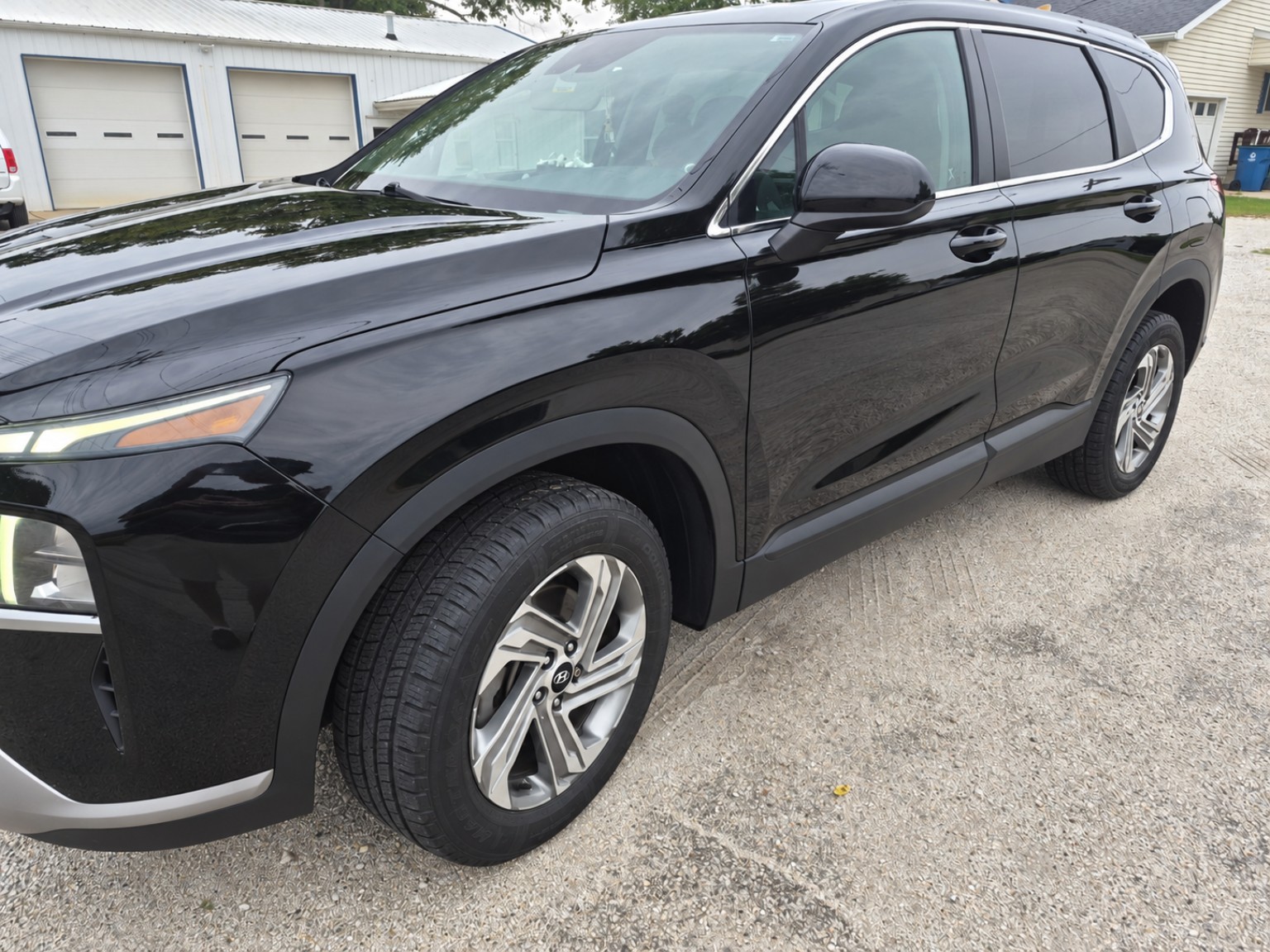 Glossy black SUV protected with 30-day wax